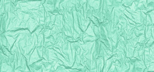 Mint green crumpled paper texture. Wrinkle pattern paper pastel color. Abstract wide background