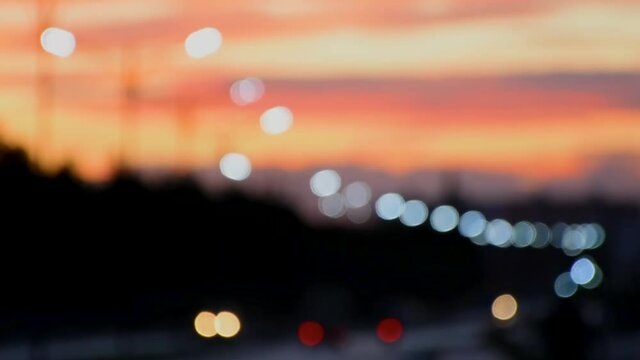 Blurred background of the highway in the sunset time, bokeh background.