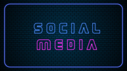 neon social media text on brick wall