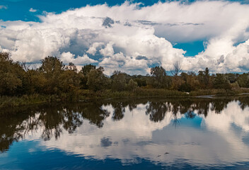 Beautiful summer view with reflections and a dramatic sky near Zeholfing, Isar, Bavaria, Germany
