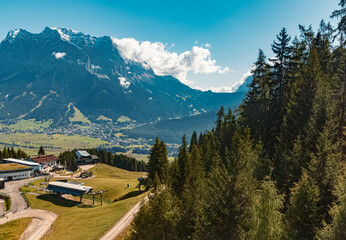 Fototapeta na wymiar Beautiful alpine summer view with the famous Zugspitze summit, top of germany, seen from the Grubigstein summit near Lermoos, Tyrol, Austria