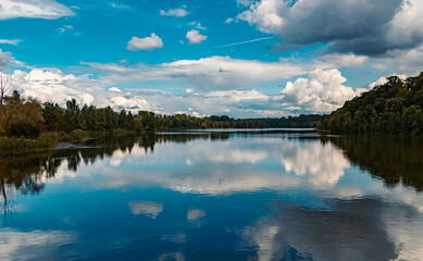 Beautiful summer view with reflections and a dramatic sky near Zeholfing, Isar, Bavaria, Germany