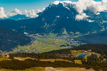 Beautiful alpine summer view with the famous Zugspitze summit, top of germany, seen from the Grubigstein summit near Lermoos, Tyrol, Austria
