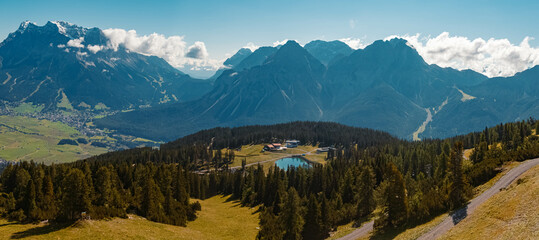 High resolution panorama of a beautiful alpine summer view with the famous Zugspitze summit, top of germany, seen from the Grubigstein summit near Lermoos, Tyrol, Austria