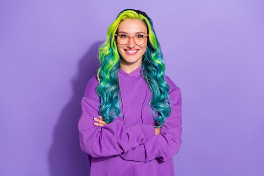 Photo of positive millennial lady with teal turquoise blue haircut cross hands isolated over violet color background