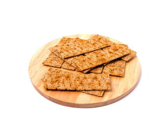 Pile of bread cracker snacks isolated over the white background