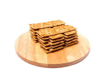 Pile of bread cracker snacks isolated over the white background
