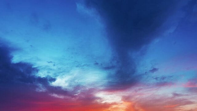 Beautiful red sunset clouds on blue sky. Dark clouds and red clouds with blue sky nature background. sky sunset clouds time lapse.