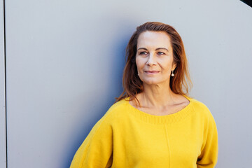 Fototapeta premium Pensive quiet middle-aged woman with a wistful expression