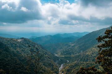 View of mountains from top under cloudy sky in Uttarakhand