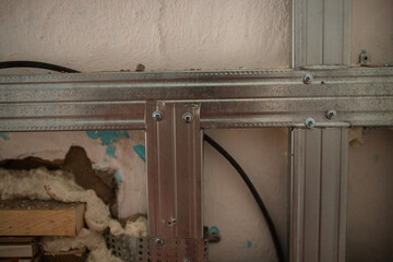The worker installed a metal profile of the wall. Metal profiles. Metal material for building walls.