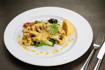 Dish with boiled cauliflower and herbs. Detox menu