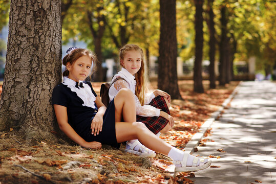 schoolgirls relaxing in the park