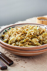 Fried white cabbage with caraway seeds and curry powder