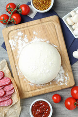 Concept of cooking pizza on gray wooden background