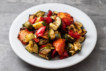 grilled chopped vegetables in white small dish