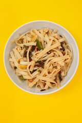 boiled noodle Udon with vegetables on ceramic bowl