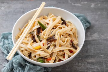 boiled noodle Udon with vegetables on ceramic bowl