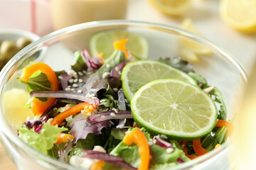 Concept of tasty food with vegetable salad with tahini sauce close up