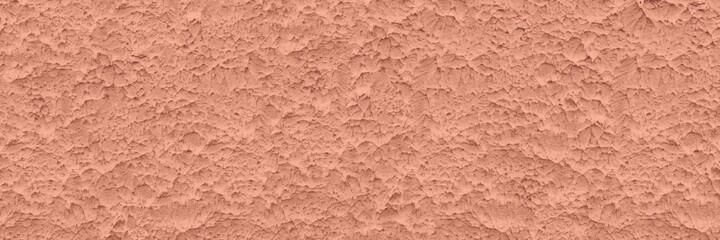Rough cement plaster wall coral color texture. Pastel muted peach textured abstract background
