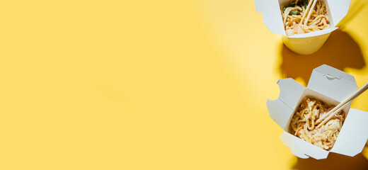 delivery of noodles on a yellow background 