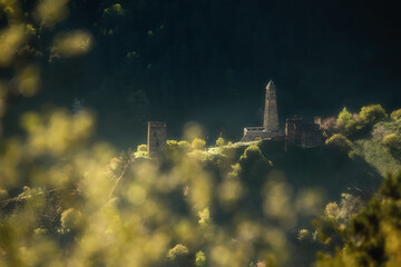 A colorful view of the Erzi tower complex. Beautiful sunny bokeh in the foreground. Clear summer...