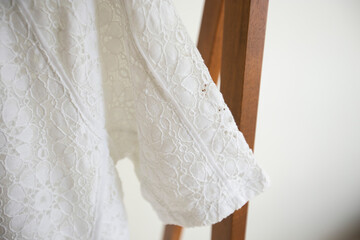 Naturel color fabric with clothes close up.