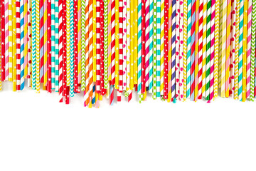 multicolored paper straws on white background