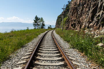 Obraz premium Circum-Baikal Railway. railway running along the shore of Lake Baikal. Russia