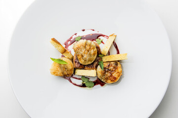 dish with scallops, foie gras and port reduction