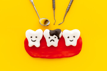 Teeth models with dentist tools. Oral health and care concept