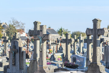 Old crosses and tombstones in the Christian cemetery. - obrazy, fototapety, plakaty