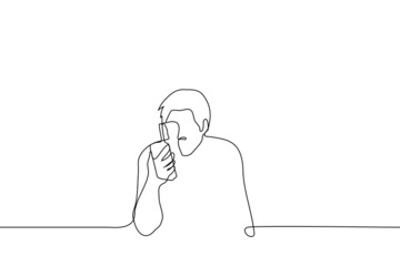 man with walkie talkie sitting - one line drawing vector. concept of talking on walkie-talkie, using baby monitor, listening to call sign on radio device