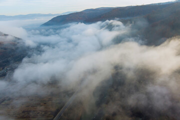 Mountain range with visible the morning colorful fog