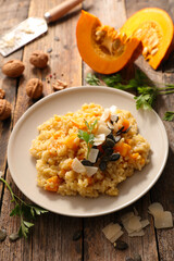 pumpkin risotto with walnut on plate