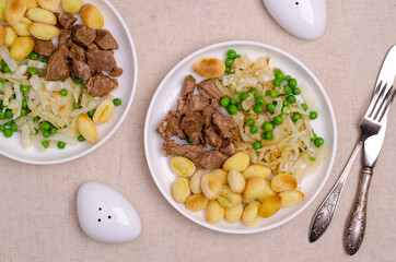 Baked gnocchi with stews and vegetables.