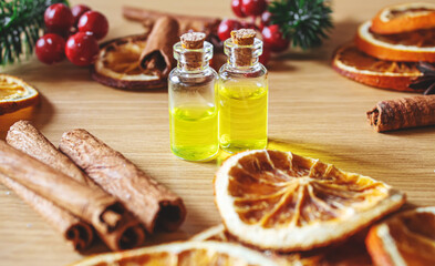 Christmas essential oils in a small bottle. Selective focus.
