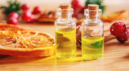 Christmas essential oils in a small bottle. Selective focus.