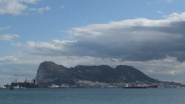 Gibraltar rock from a beach a cloudy day