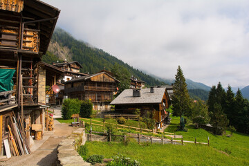 Fototapeta na wymiar Traditional wooden buildings in the Alpine village of Sauris di Sopra, Udine Province, Friuli-Venezia Giulia, north east Italy 