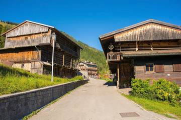 A road of traditional wooden buildings in the Alpine village of Sauris di Sopra, Udine Province, Friuli-Venezia Giulia, north east Italy
