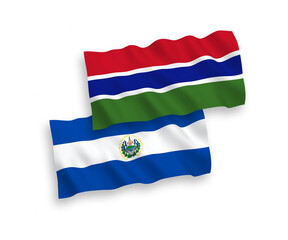 National vector fabric wave flags of Republic of El Salvador and Republic of Gambia isolated on white background. 1 to 2 proportion.