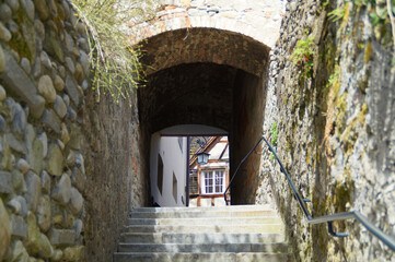 an old quaint narrow street in Bregenz (Austria) on sunny spring day	
