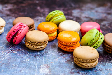 Selection of colorful french macaroons on   industrial background . Patisserie Banner
