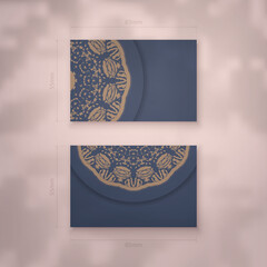 Blue color business card template with brown mandala ornament for your brand.