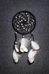 Dreamcatcher on the gray background