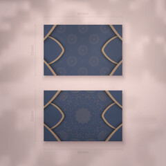 Blue color business card template with brown mandala pattern for your contacts.