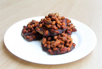 Gula kacang, is a traditional snack from Indonesia, made from roasted peanuts and brown sugar. Also called as Ampyang