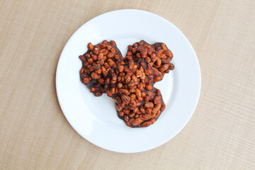 Gula kacang, is a traditional snack from Indonesia, made from roasted peanuts and brown sugar. Also called as Ampyang