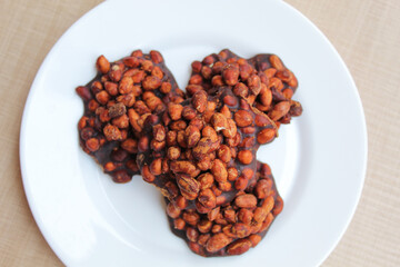 Gula kacang, is a traditional snack from Indonesia, made from roasted peanuts and brown sugar. Also called as Ampyang